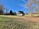 Ranch home with a large grassy yard and detached shed at 940 Devil Track Rd, Taylorsville, NC 28681