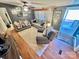 Bright living room featuring hardwood floors and ample seating at 940 Devil Track Rd, Taylorsville, NC 28681