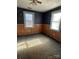 Bedroom with wood paneling, carpet, and ceiling fan at 1008 Rockland Sw Cir, Concord, NC 28027