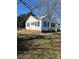 Side view of the house showing yard and landscaping at 1008 Rockland Sw Cir, Concord, NC 28027