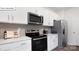 Stainless steel appliances and white shaker cabinets in kitchen at 116 Meadow View Dr, Statesville, NC 28677