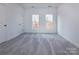 Spacious bedroom featuring grey carpet and double door closet at 2212 Noble Townes Way, Charlotte, NC 28262