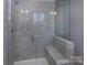 Modern bathroom with walk-in shower and gray tile at 2220 Noble Townes Way, Charlotte, NC 28262