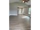 Spacious living room with vinyl plank flooring and neutral paint at 3010 Forbes Rd, Gastonia, NC 28056