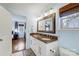 Double vanity bathroom with granite countertop and view into bedroom at 3520 Ritch Ave, Charlotte, NC 28206