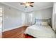 Charming bedroom with hardwood floors, ceiling fan and window with shutters at 3520 Ritch Ave, Charlotte, NC 28206