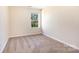 Simple bedroom with carpeted floors and a window at 9036 Bradstreet Commons Way, Charlotte, NC 28215