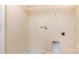 Laundry closet with shelving and hookups for washer and dryer at 9036 Bradstreet Commons Way, Charlotte, NC 28215