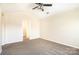 Spacious bedroom with access to a bathroom and carpet flooring at 9036 Bradstreet Commons Way, Charlotte, NC 28215