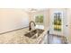 Kitchen features granite countertops and a stainless steel sink at 9036 Bradstreet Commons Way, Charlotte, NC 28215
