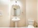 Small bathroom with pedestal sink and toilet at 9036 Bradstreet Commons Way, Charlotte, NC 28215