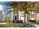 Two-story townhome with attached garage and stone accents at 9036 Bradstreet Commons Way, Charlotte, NC 28215