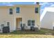 Tan vinyl siding exterior with a patio and grill at 9036 Bradstreet Commons Way, Charlotte, NC 28215