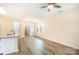 Bright living room with hardwood floors and access to kitchen at 9036 Bradstreet Commons Way, Charlotte, NC 28215