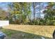 Private backyard with mature trees and grassy area at 9036 Bradstreet Commons Way, Charlotte, NC 28215