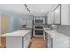 Modern kitchen with stainless steel appliances and white cabinets at 12006 Woodside Falls Rd, Pineville, NC 28134