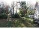 Spacious backyard with mature trees, ideal for relaxation and privacy at 1541 Hunt Club Ct, Rock Hill, SC 29732