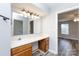 Clean bathroom with wood vanity and updated light fixture at 1541 Hunt Club Ct, Rock Hill, SC 29732