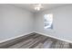 Well-lit bedroom with hardwood floors and a window at 1541 Hunt Club Ct, Rock Hill, SC 29732