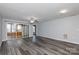 Bright living room featuring hardwood floors and sliding glass doors leading to a sunroom at 1541 Hunt Club Ct, Rock Hill, SC 29732