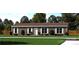 Single-story home with brown siding and landscaping at 210 Sailwinds Rd, Mooresville, NC 28115