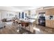 Open concept kitchen with island, modern appliances, and breakfast bar at 210 Sailwinds Rd, Mooresville, NC 28115
