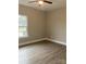 Spacious bedroom with large window and wood-look flooring at 3008 Forbes Rd, Gastonia, NC 28056