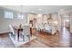 Kitchen and dining area with hardwood floors and a large center island at 4025 Grace Pointe Dr # 105, Wesley Chapel, NC 28079