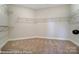 Large walk-in closet with ample shelving and hanging space at 4025 Grace Pointe Dr # 105, Wesley Chapel, NC 28079
