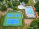 Community pool, tennis courts, and playground at 13002 Red Vulcan Ct, Charlotte, NC 28213