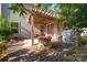 Backyard patio with pergola, fire pit, and built-in grill at 13002 Red Vulcan Ct, Charlotte, NC 28213