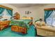 Bedroom with wooden bed frame and teal carpet at 1515 Delview Rd, Cherryville, NC 28021