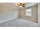 Bright bedroom featuring grey carpet and ceiling fan at 1830 Ebenezer Rd, Rock Hill, SC 29732