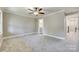 Bright bedroom with carpet flooring, ceiling fan and ensuite bathroom at 1830 Ebenezer Rd, Rock Hill, SC 29732