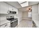 Updated kitchen with white cabinets, black appliances and a breakfast nook at 1830 Ebenezer Rd, Rock Hill, SC 29732