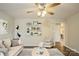 Living room with light beige walls, hardwood floors, and staged furniture at 485 Nc 801 Hwy, Woodleaf, NC 27054