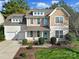 Two-story house with a beige exterior, two-car garage, and landscaped lawn at 530 Cotton Field Rd, Rock Hill, SC 29732