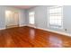 Spacious living room with hardwood floors and large windows at 6925 Lancer Dr, Charlotte, NC 28226