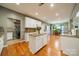 Modern kitchen with white cabinets, granite counters and an island at 10126 Loch Lomond Dr, Charlotte, NC 28278