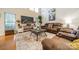 Living room with large TV, fireplace and comfortable seating at 10126 Loch Lomond Dr, Charlotte, NC 28278