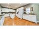 Well-equipped kitchen featuring white cabinets and granite countertops at 10126 Loch Lomond Dr, Charlotte, NC 28278
