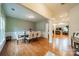 Formal dining room with hardwood floors, a large table, and access to living room at 10126 Loch Lomond Dr, Charlotte, NC 28278