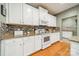 Clean kitchen with white cabinets, granite countertops and modern appliances at 10126 Loch Lomond Dr, Charlotte, NC 28278