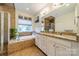 Elegant bathroom with double vanity, soaking tub, and shower at 10126 Loch Lomond Dr, Charlotte, NC 28278