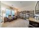 Home office or bar area with extensive shelving and comfortable seating at 10126 Loch Lomond Dr, Charlotte, NC 28278