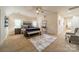 Secondary bedroom with plush carpet and sitting area at 10126 Loch Lomond Dr, Charlotte, NC 28278