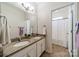 Clean bathroom with double vanity and shower/tub combo at 10126 Loch Lomond Dr, Charlotte, NC 28278
