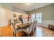 Bright dining room featuring a large wooden table with seating for six at 10126 Loch Lomond Dr, Charlotte, NC 28278