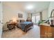 Charming bedroom with a wooden bed frame and built-in desk at 10126 Loch Lomond Dr, Charlotte, NC 28278