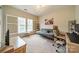 Bright home office with a futon, desk, and ample natural light at 10126 Loch Lomond Dr, Charlotte, NC 28278